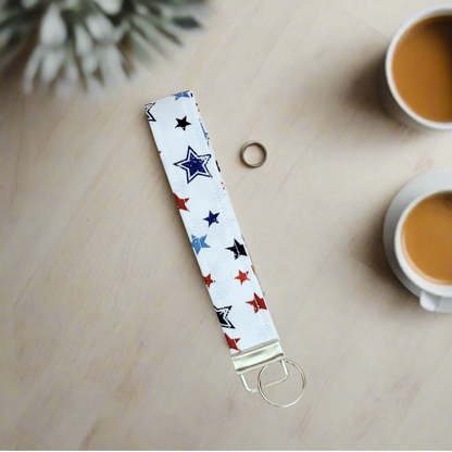 Keychain Wristlet with blue and red stars design on white fabric